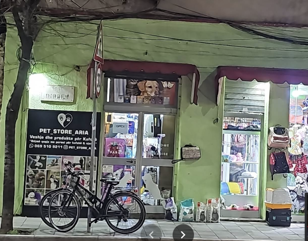 Pet supply shops in Tirana with Green Paint on outside of building